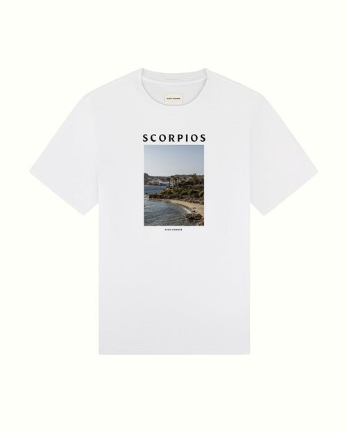 White t-shirt with 'SCORPIOS' text and a scenic print on a white background